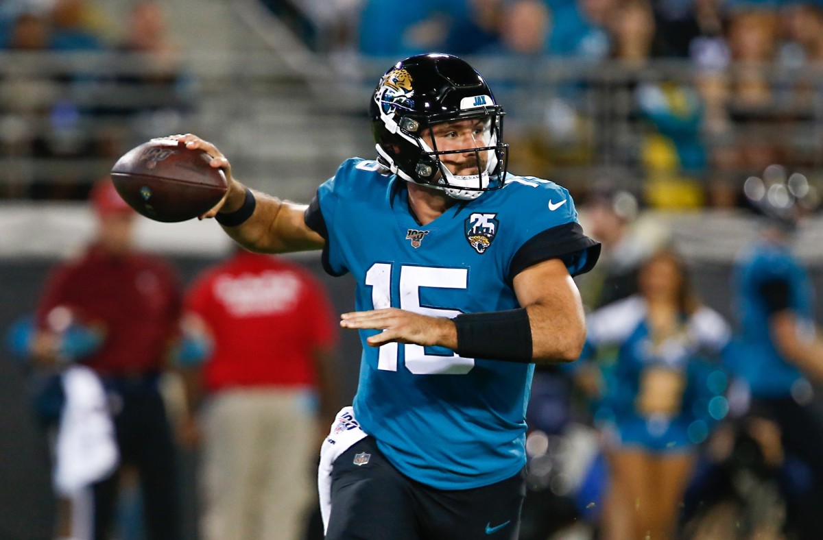 Jacksonville Jaguars quarterback Gardner Minshew (15) drops to throw a pass during the second half against the Tennessee Titans at TIAA Bank Field.